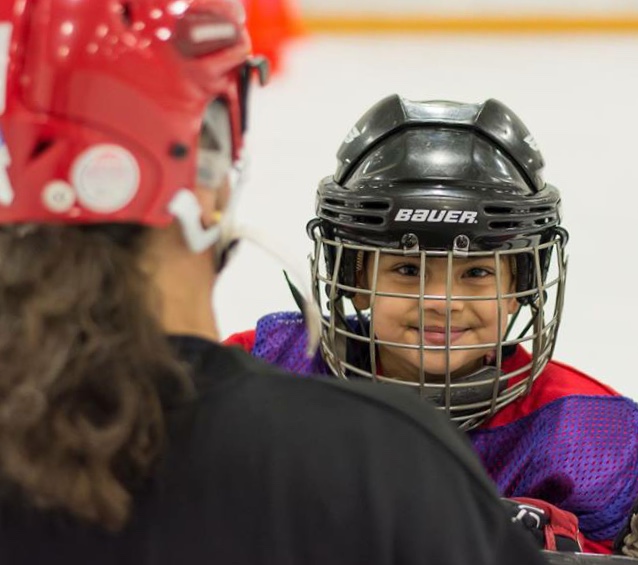 Dr. Kate coaching hockey